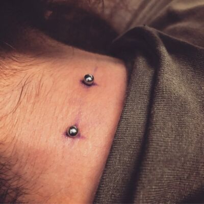 Neck Piercing by Underground Tattoos Watford